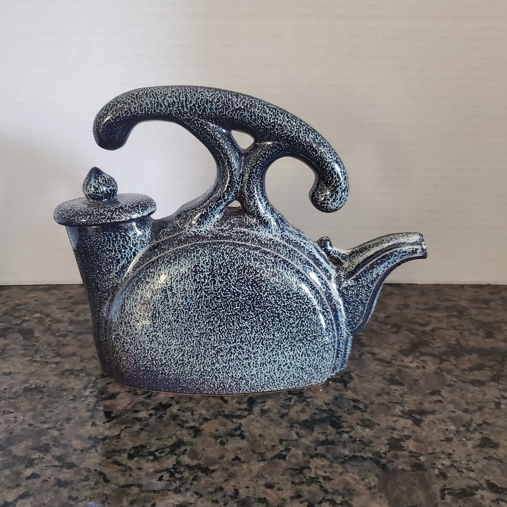 Vintage Porcelain  Teapot With Unique Design .